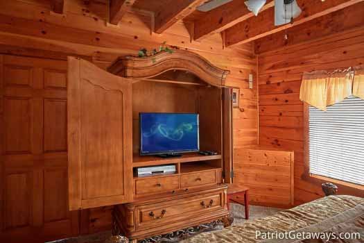 King bedroom with flat screen tv at The Big View, a 4 bedroom cabin rental located in Pigeon Forge