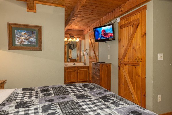 TV and en suite bath at Golden Memories, a 1 bedroom cabin rental located in Pigeon Forge