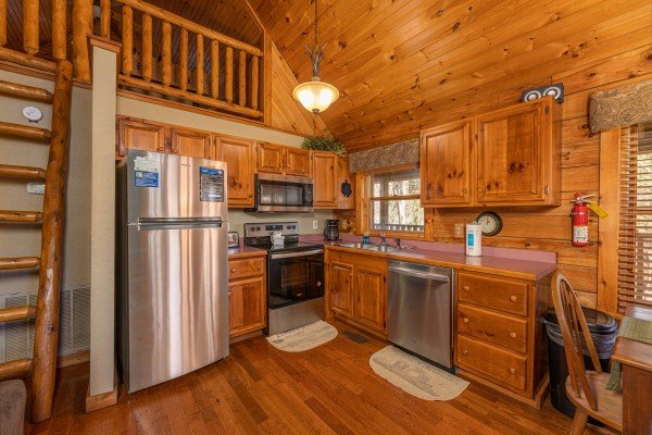 Kitchen with stainless appliances at Golden Memories, a 1 bedroom cabin rental located in Pigeon Forge