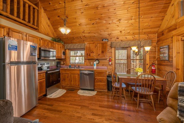 Kitchen and dining space at Golden Memories, a 1 bedroom cabin rental located in Pigeon Forge