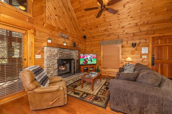 Recliner and sofa in the living room at Golden Memories, a 1 bedroom cabin rental located in Pigeon Forge