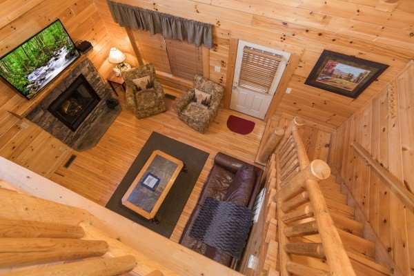 Looking down at the living room at 5 Little Cubs, a 2 bedroom cabin rental located in Pigeon Forge