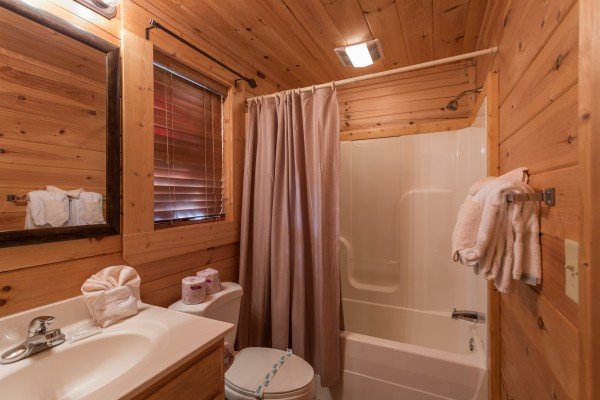 Tub and shower at 5 Little Cubs, a 2 bedroom cabin rental located in Pigeon Forge