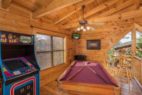 Game room with pool and arcade at 5 Little Cubs, a 2 bedroom cabin rental located in Pigeon Forge