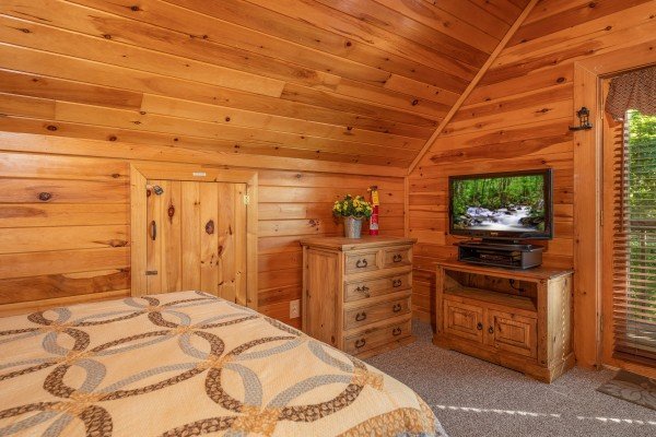 Dresser, TV, and TV stand in the loft bedroom at Grand View, a 3 bedroom cabin rental located in Sevierville