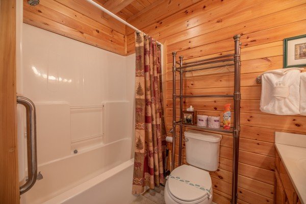 Bathroom with a tub and shower at Grand View, a 3 bedroom cabin rental located in Sevierville