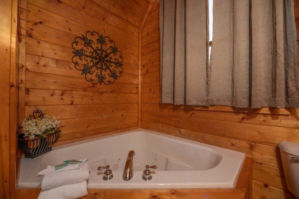 Corner jacuzzi tub at Majestic Mountain, a 4 bedroom cabin rental located in Pigeon Forge