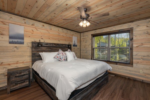 Bedroom with a night stand at Heaven's Hill, a 3 bedroom cabin rental located in Gatlinburg