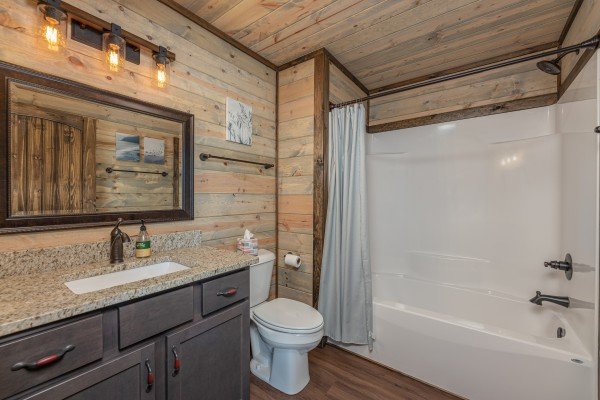 Bathroom with a tub and shower at Heaven's Hill, a 3 bedroom cabin rental located in Gatlinburg