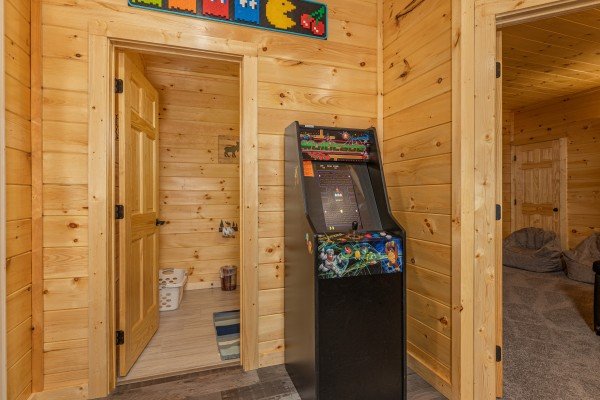 Arcade game at Wet Feet Retreat, a 5 bedroom cabin rental located in Pigeon Forge