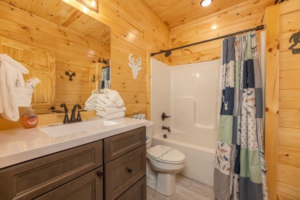 Bathroom with a tub and shower at Wet Feet Retreat, a 5 bedroom cabin rental located in Pigeon Forge