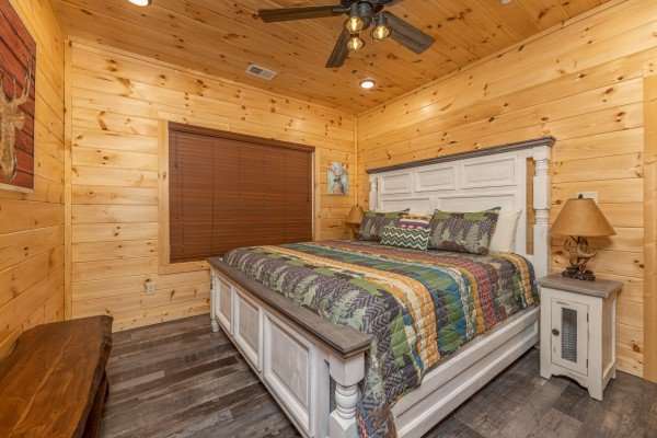 White bed with night stands and lamps at Wet Feet Retreat, a 5 bedroom cabin rental located in Pigeon Forge