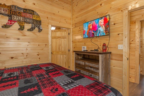 Dresser and TV in a bedroom at Wet Feet Retreat, a 5 bedroom cabin rental located in Pigeon Forge