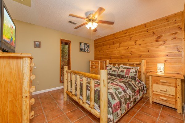 King bedroom with TV at Copper Owl, a 2 bedroom cabin rental located in Pigeon Forge