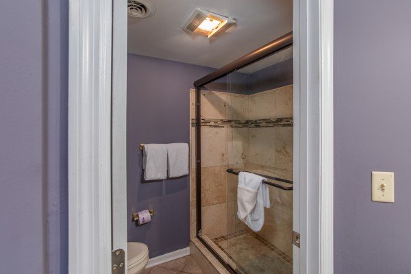 Bathroom with walk in shower at The Majestic, an 8 bedroom cabin rental located in Gatlinburg