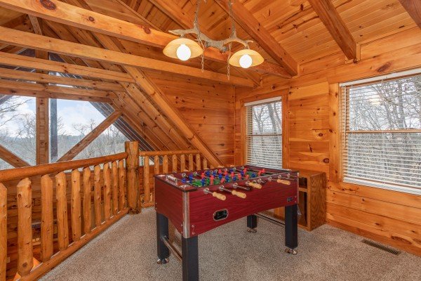 Foosball table at The Cowboy Way, a 4 bedroom cabin rental located in Pigeon Forge