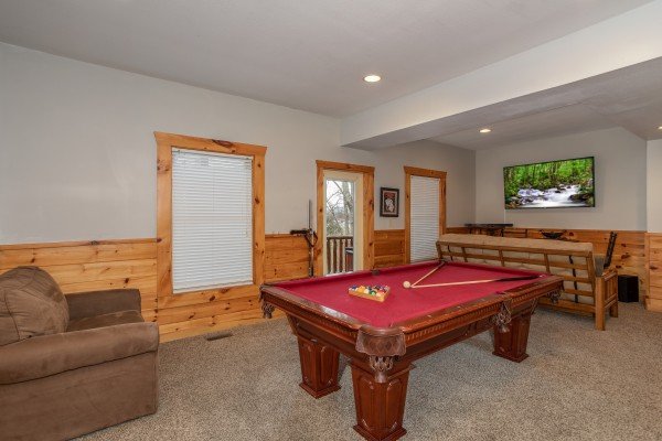 Pool table in the game room at The Cowboy Way, a 4 bedroom cabin rental located in Pigeon Forge