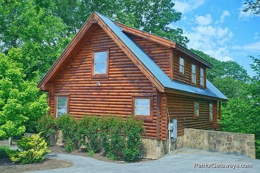 Side exterior view of the cabin at The Cowboy Way, a 4 bedroom cabin rental located in Pigeon Forge