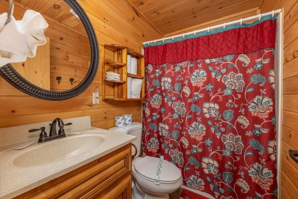 Bathroom with a tub and shower at Cabin Life, a 2 bedroom cabin rental located in Pigeon Forge