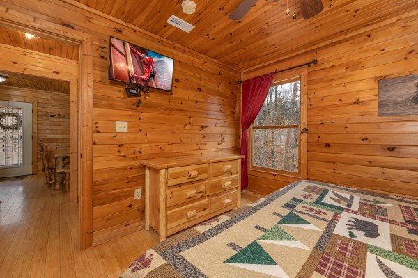 Dresser and TV in a bedroom at Cabin Life, a 2 bedroom cabin rental located in Pigeon Forge
