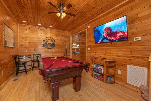 Game room with pool table and large TV at Cabin Life, a 2 bedroom cabin rental located in Pigeon Forge