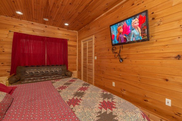 TV in a bedroom at Cabin Life, a 2 bedroom cabin rental located in Pigeon Forge
