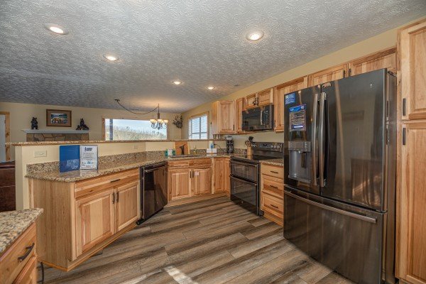 Kitchen with stainless appliances at Le Bear Chalet, a 7 bedroom cabin rental located in Gatlinburg