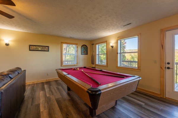 Red felt pool table at Le Bear Chalet, a 7 bedroom cabin rental located in Gatlinburg