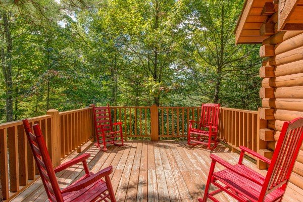 Rocking chairs on the deck at Cupid's Crossing, a 1 bedroom cabin rental located in Pigeon Forge