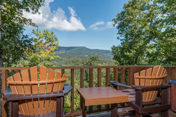 Two chairs and a mountain view on the deck at Cupid's Crossing, a 1 bedroom cabin rental located in Pigeon Forge