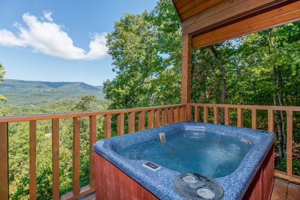 Hot tub on the deck at Cupid's Crossing, a 1 bedroom cabin rental located in Pigeon Forge