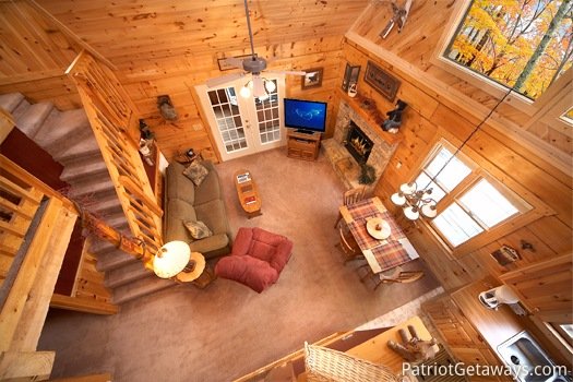 Looking down into the living room from the loft at Hooked on Bears, a 2 bedroom cabin rental located in Pigeon Forge