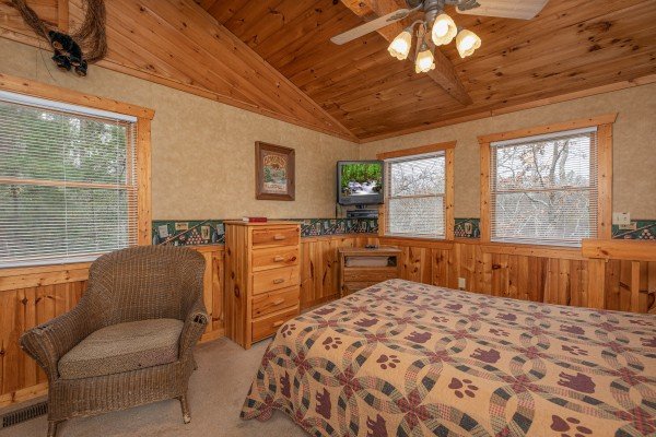 Dresser, chair, and TV in a bedroom at Hooked on Bears, a 2 bedroom cabin rental located in Pigeon Forge
