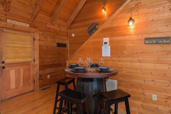 Dining table for four at Bear Mountain, a 2 bedroom cabin rental located in Pigeon Forge