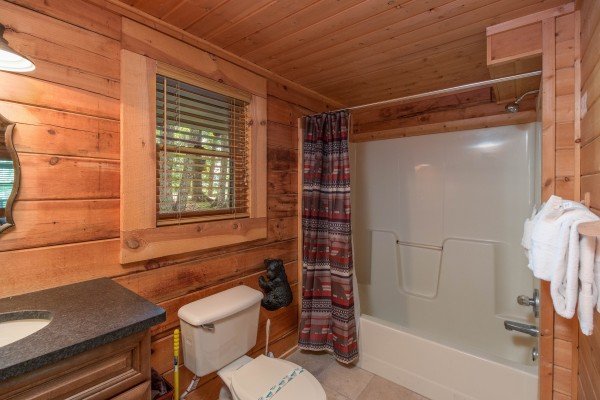 Bathroom with tub and shower at Bear Mountain, a 2 bedroom cabin rental located in Pigeon Forge