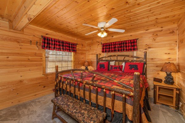Log bed, night stands, and lamps at A Mountain Hyde-a Way, a 2 bedroom cabin rental located in Pigeon Forge
