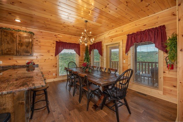 Dining table for eight at Elk Horn Lodge, a 5 bedroom cabin rental located in Gatlinburg