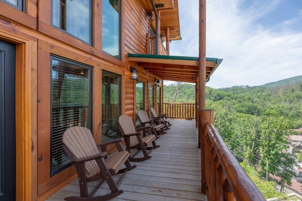 Rocking chairs on a covered deck at Elk Horn Lodge, a 5 bedroom cabin rental located in Gatlinburg