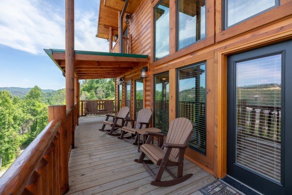Rocking chairs on a large covered deck at Elk Horn Lodge, a 5 bedroom cabin rental located in Gatlinburg