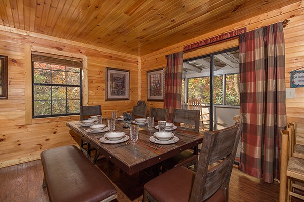 Dining space for eight at Up the Creek, a 4 bedroom cabin rental located in Gatlinburg