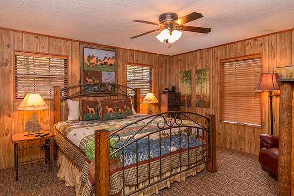 King bed with two nightstands and lamps at Up the Creek, a 4 bedroom cabin rental located in Gatlinburg