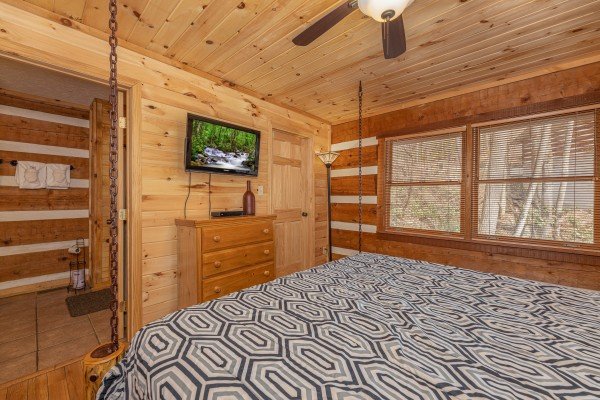 TV and dresser in the bedroom at Wild at Heart, a 1 bedroom cabin rental located in Gatlinburg