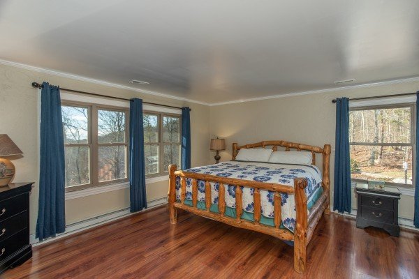 Bedroom with a log bed at Best View Ever! A 5 bedroom cabin rental in Pigeon Forge