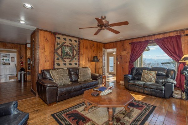 Living room with a sofa, chair, and loveseat at Best View Ever! A 5 bedroom cabin rental in Pigeon Forge