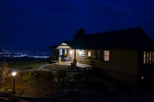 The cabin at night with city lights at Best View Ever! A 5 bedroom cabin rental located in Pigeon Forge