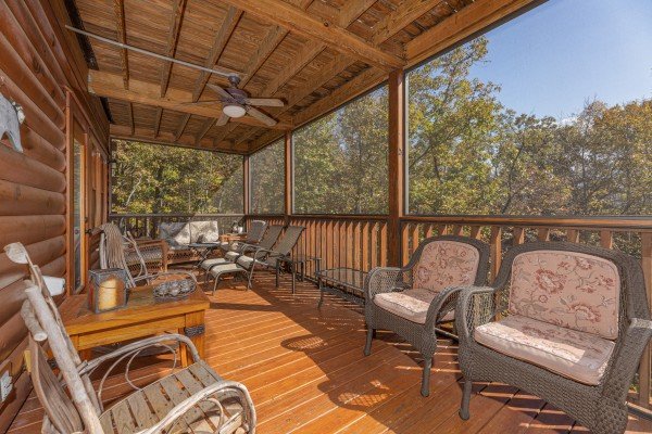 Lots of seating on a covered deck at Sensational Views, a 3 bedroom cabin rental located in Gatlinburg