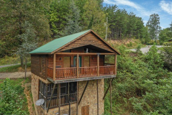 Rear exterior of the cabin built into the hillside at Paradise View, a 1 bedroom cabin rental located in Pigeon Forge