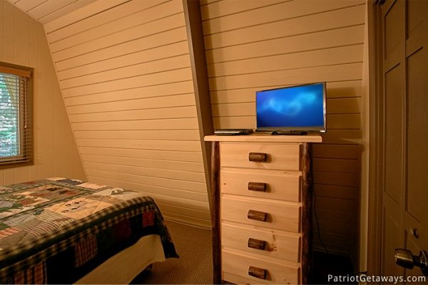 Television in bedroom at Gatlinburg Lodge, a 6-bedroom cabin rental located in Gatlinburg