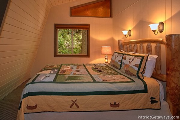 Full sized bed in third floor bedroom at Gatlinburg Lodge, a 6-bedroom cabin rental located in Gatlinburg