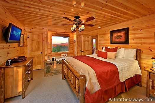 Second floor bedroom with queen bed and jacuzzi tub at Gone to Therapy, a 2-bedroom cabin rental located in Gatlinburg